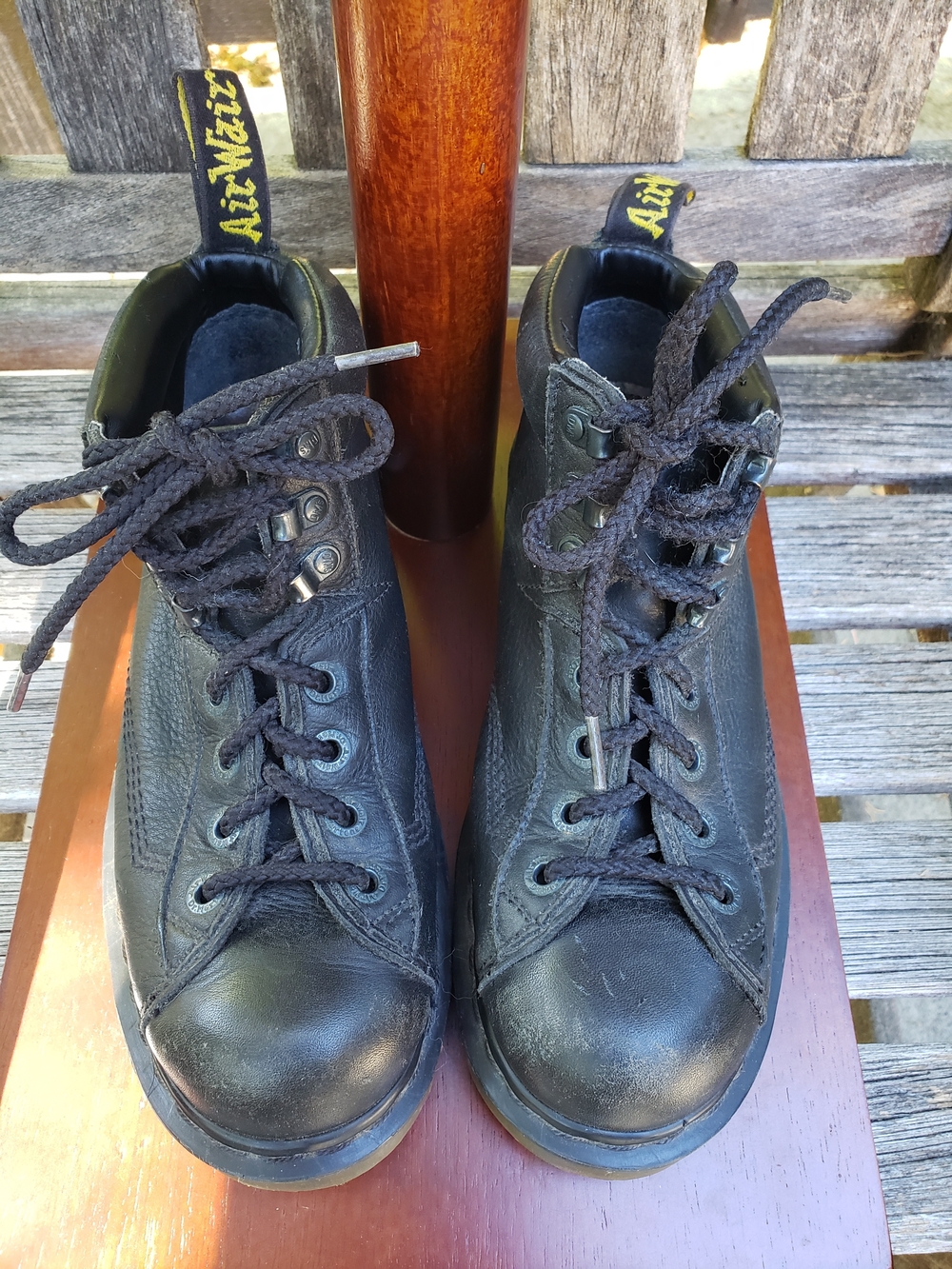 Dr. Martens Black Leather Lace-Up Ankle Booties with Yellow Heel Loop Accent